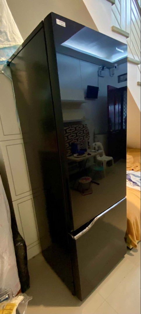 Panasonic Refrigerator - Black Glass Door (Category: Refrigerators and Freezers) located in Las Pinas. Submitted by vrefplusfive (Listing ID 1440551354, Image 3). Description: - Sleek black glass door finish - Ample storage space for all your groceries - Multiple shelves and drawers for organized storage - Bright LED interior lighting for easy visibility - Excellent working condition, keeps food perfectly fresh -like new 2 years old -no issue -no