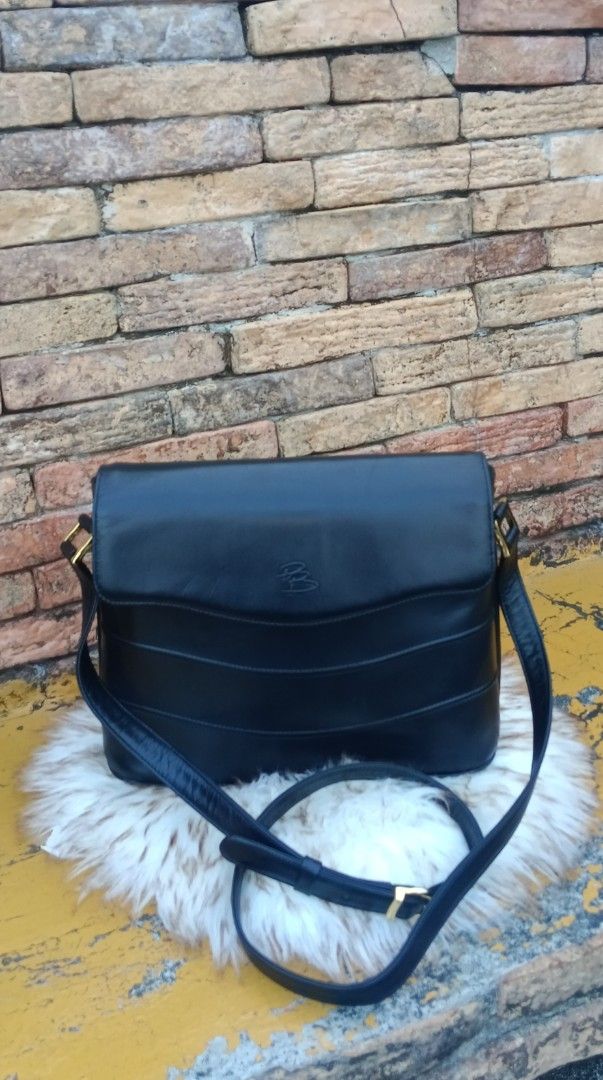 Pierre Balmain Paris Black Leather Bag (Category: Luxury Bags & Wallets) located in Legazpi City. Submitted by georgepineda791 (Listing ID 1440517605, Image 1). Description: - Authentic Pierre Balmain Paris black leather shoulder bag. - Elegant curved flap design. - Adjustable shoulder strap with a classic gold buckle. - with interior pockets for organization. - Versatile: suitable for daily use or special events. - Condition: Clean and well-main