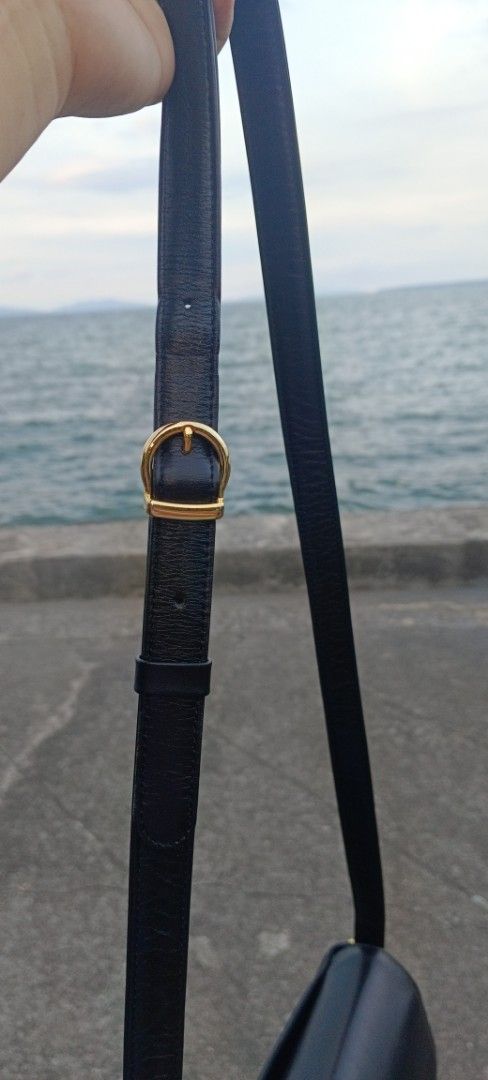 Pierre Balmain Paris Black Leather Bag (Category: Luxury Bags & Wallets) located in Legazpi City. Submitted by georgepineda791 (Listing ID 1440517605, Image 2). Description: - Authentic Pierre Balmain Paris black leather shoulder bag. - Elegant curved flap design. - Adjustable shoulder strap with a classic gold buckle. - with interior pockets for organization. - Versatile: suitable for daily use or special events. - Condition: Clean and well-main