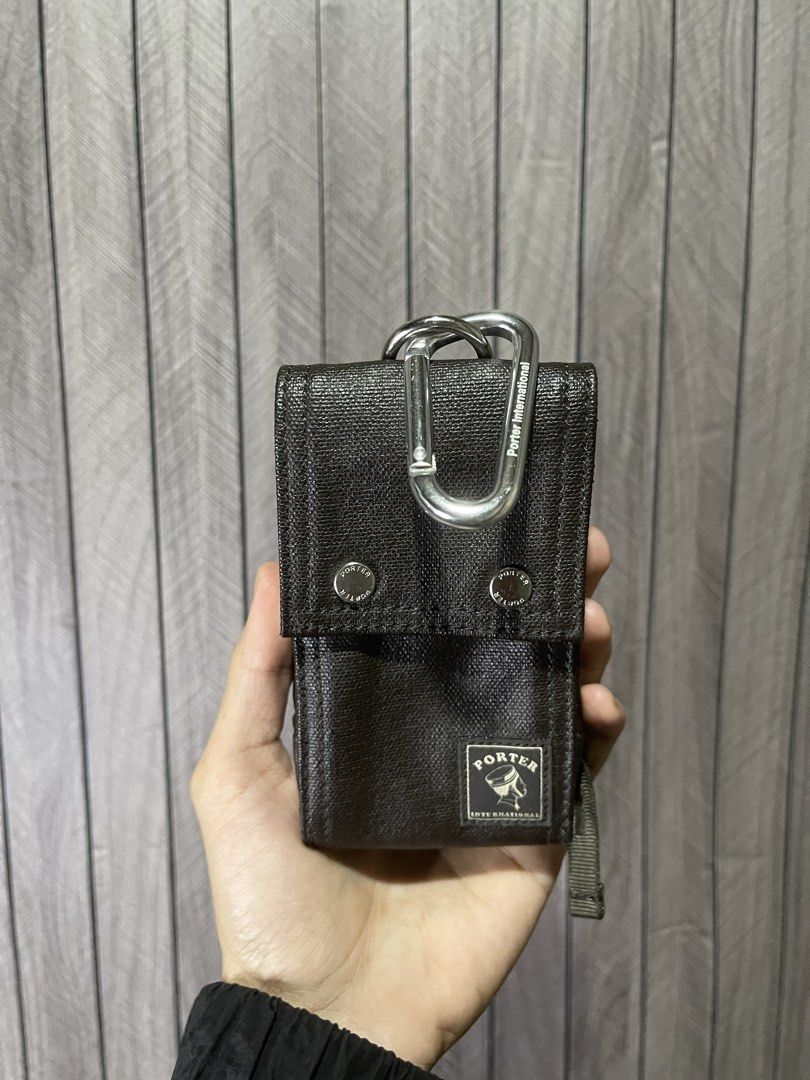 Porter International Leather Mini Utility Pouch (Category: Belt bags, Clutches and Pouches) located in Santa Cruz. Submitted by hongkongmarketph (Listing ID 1440534499, Image 1). Description: Porter International Leather Mini Utility Pouch Authentic Porter International compact pouch made with textured leather finish. Perfect for small essentials like cards, keys, earphones, coins, or small gadgets. *Features: • Snap button closure • Metal carabi