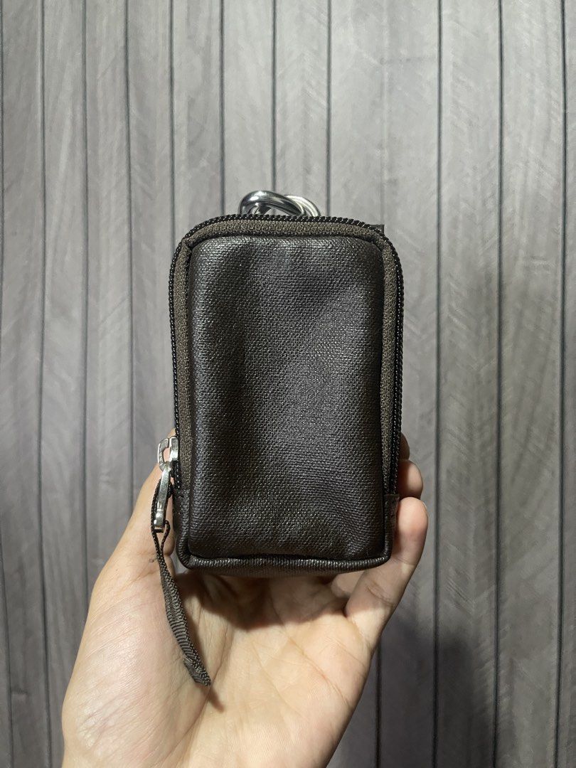 Porter International Leather Mini Utility Pouch (Category: Belt bags, Clutches and Pouches) located in Santa Cruz. Submitted by hongkongmarketph (Listing ID 1440534499, Image 3). Description: Porter International Leather Mini Utility Pouch Authentic Porter International compact pouch made with textured leather finish. Perfect for small essentials like cards, keys, earphones, coins, or small gadgets. *Features: • Snap button closure • Metal carabi