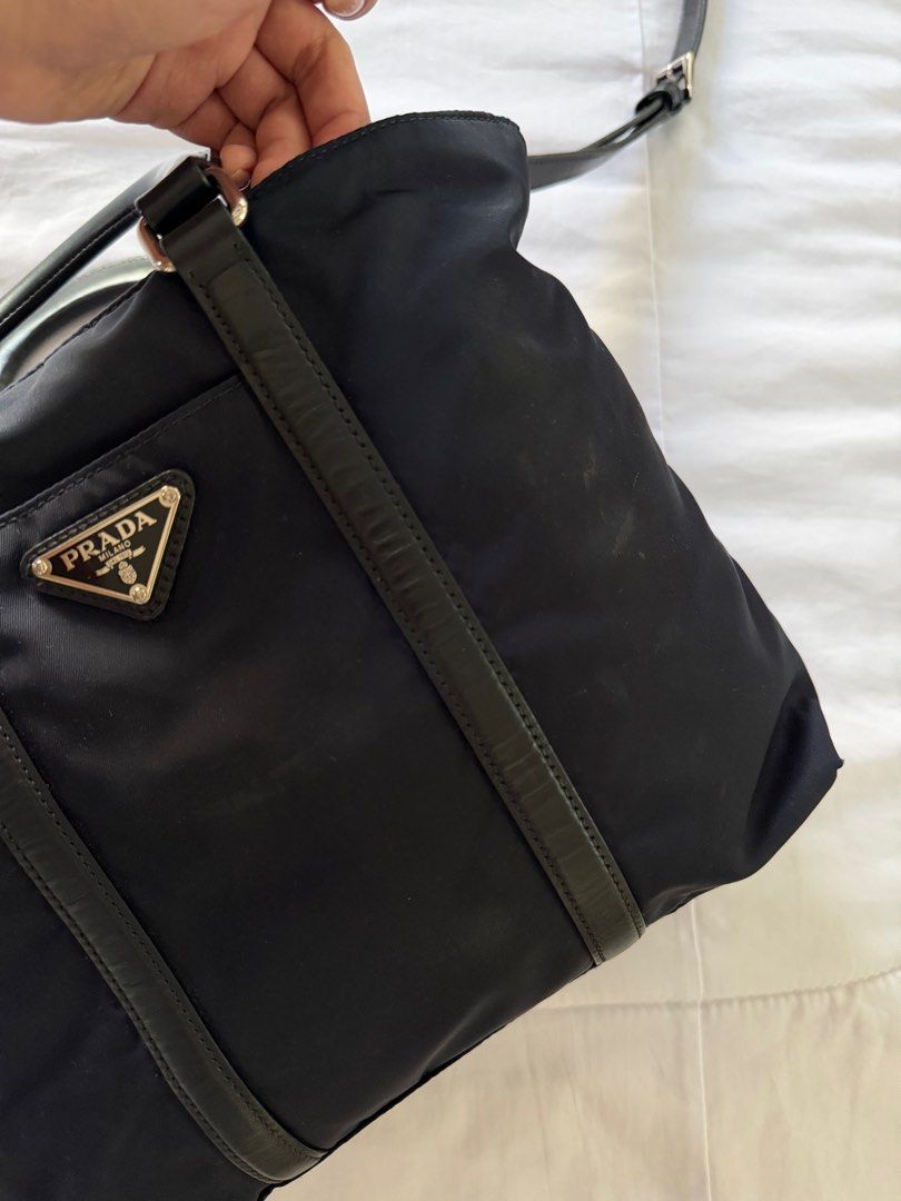 Prada Tessuto Nylon Tote Bag (Category: Luxury Bags & Wallets) located in Quezon City. Submitted by mncdc (Listing ID 1440406066, Image 2). Description: Prada Tessuto Black Nylon Tote Bag with Leather Trim Small Condition: 7/10 With minimal stains Complete inclusions.