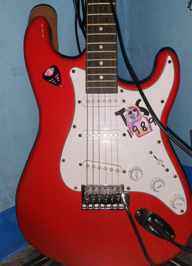 Red Electric Guitar Fernando Stratocaster Complete (Category: Musical Instruments) located in Manila. Submitted by kenghiecom00141 (Listing ID 1440440396, Image 1). Description: Fernando Guitar Brand Complete with box,accesories and strap. No issues unli test and check all working no dents .