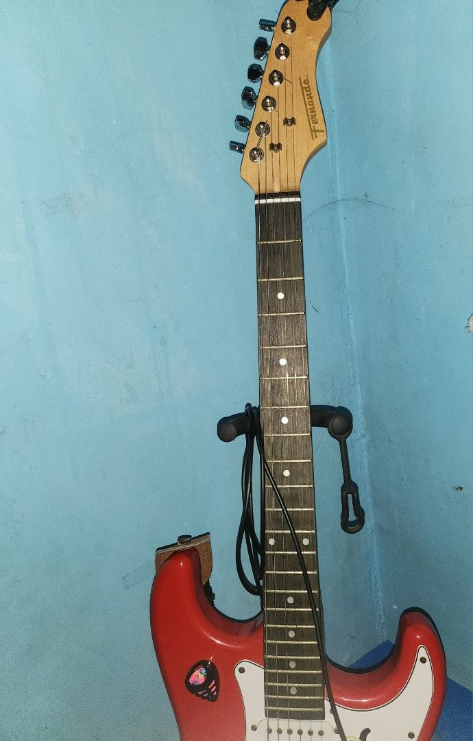 Red Electric Guitar Fernando Stratocaster Complete (Category: Musical Instruments) located in Manila. Submitted by kenghiecom00141 (Listing ID 1440440396, Image 2). Description: Fernando Guitar Brand Complete with box,accesories and strap. No issues unli test and check all working no dents .