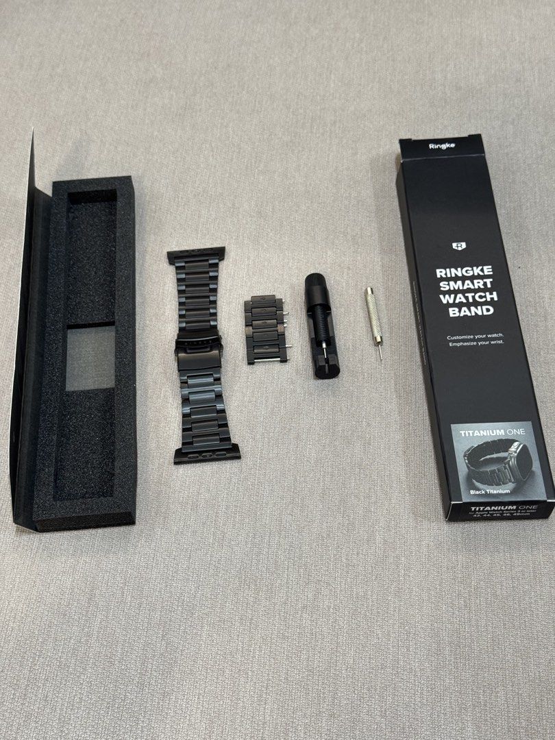 Ringke Titanium One Smart Watch Band for Apple Watch (Category: Wearables & Smart Watches) located in Pasig City. Submitted by crazy.dave (Listing ID 1440519613, Image 2). Description: - Premium black titanium band for Apple Watch - Diamond-Like Coating (same process with Black Titanium Apple Watch Ultra) - Compatible with 44mm, 45mm, 46mm, and 49mm models - Includes extra links and resizing tool for a perfect fit - Achieve a premium look for you