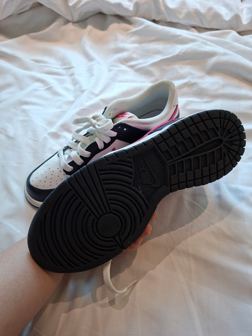 Rush!! Nike Dunk Low Pink Swoosh White Black (Category: Sneakers) located in Manila. Submitted by pupsik.tan (Listing ID 1440505699, Image 2). Description: - Authentic Nike Dunk Low sneakers - Classic silhouette with a white base - Features striking black and pink accents - Clean white laces - Durable black rubber soles - Ideal for everyday casual wear.