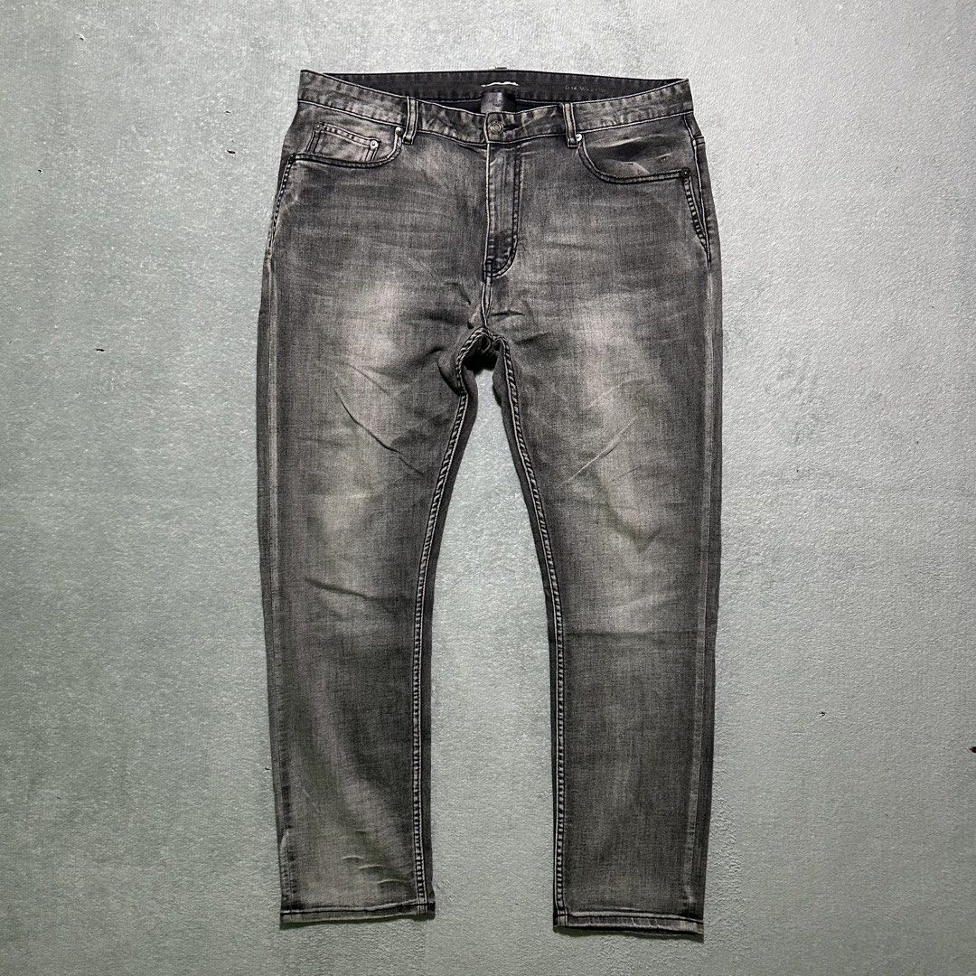 Saint Laurent Grey Washed Denim Jeans (Category: Jeans) located in Villaverde. Submitted by bakatzy_secondhand_garments (Listing ID 1440391415, Image 1). Description: - Brand: Saint Laurent - Color: Grey Washed Denim - Style: Classic Five-Pocket - Closure: Button and Zip Fly - Fit: Straight Leg - Ideal for: Everyday Wear - Note: Please check measurements for exact fit.