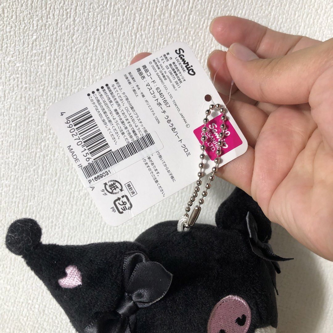 Sanrio Kuromi Plush Keychain Pouch (Category: Plushies & Soft Toys) located in Manila. Submitted by mekabee_moon (Listing ID 1440487742, Image 2). Description: - Adorable Sanrio Kuromi plush pouch - Stylish black and white design with a cute skull detail - Secure zipper closure for your essentials - Includes a ball chain for easy attachment as a bag charm - Perfect for organizing small items on the go - Made in China.