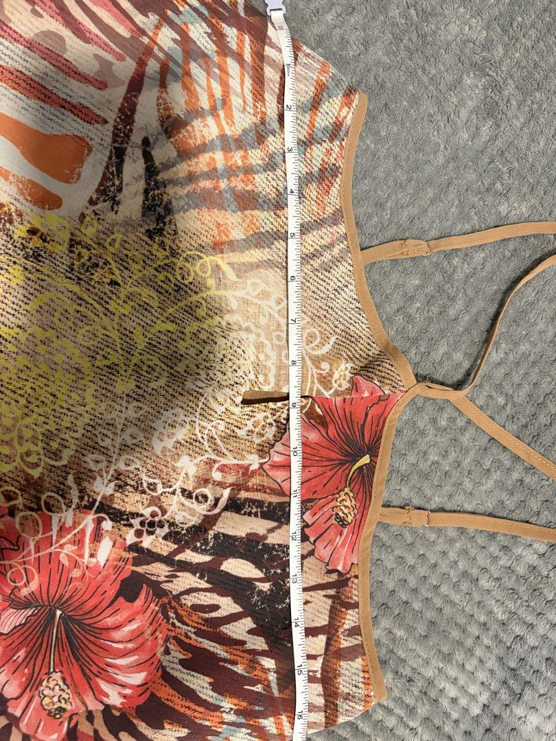Layered Tropical Floral Print Halter Top (Category: Sleeveless) located in Manila. Submitted by icy_________ (Listing ID 1440394380, Image 2). Description: - Light and airy layered tank top - Vibrant tropical print with hibiscus and animal accents - Tan chiffon overlay at the hem - Adjustable spaghetti straps - Ideal for beach vacations or casual summer days.