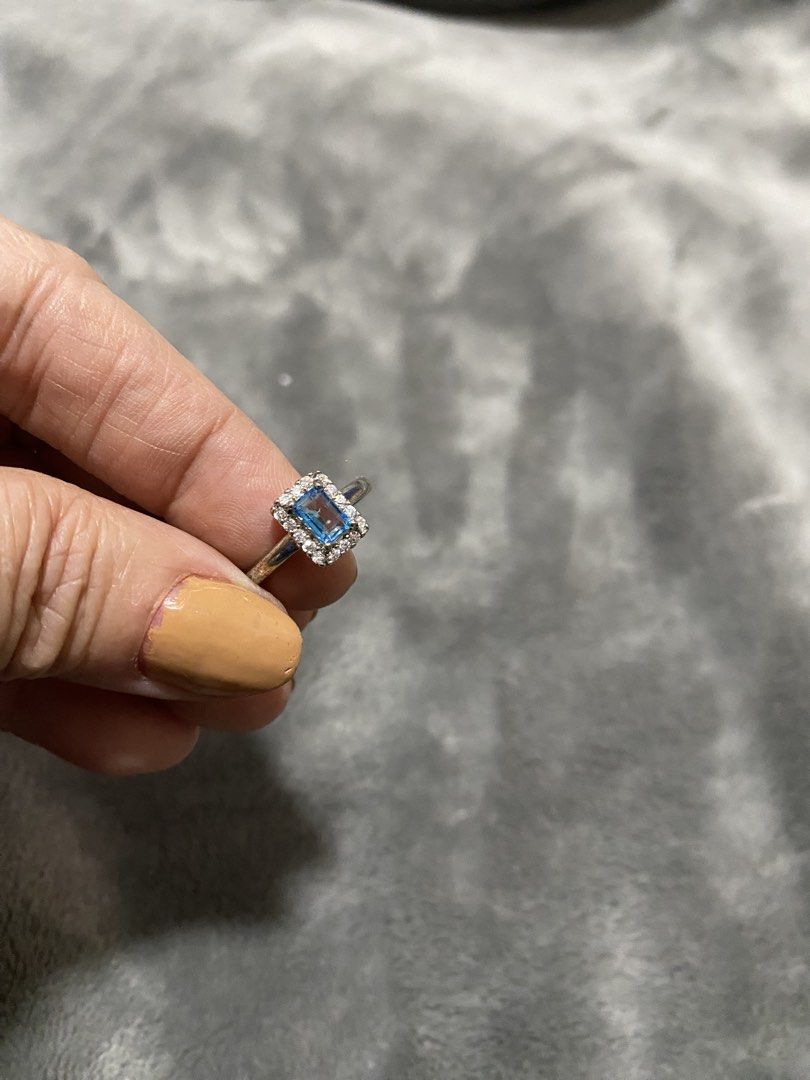 Silver Ring with Blue Stone and White Accents (Category: Rings) located in Manila. Submitted by robinhood123_134 (Listing ID 1440510791, Image 2). Description: - Elegant silver-toned ring - Features a striking rectangular blue stone - Accented with sparkling small white stones - Estimated size 6 or 7 - Versatile for everyday wear or special events - Feel free to ask any questions!.