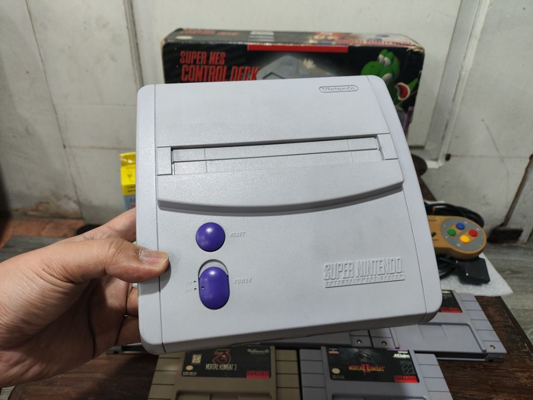 SNES Jr. - Super Nintendo Entertainment System Jr. Console w/ Box [Bundle #9] (Category: Nintendo) located in Quezon City. Submitted by yinyinyang69 (Listing ID 1440498088, Image 2). Description: SNES Jr. - Super Nintendo Entertainment System Jr. Console w/ BOX [Bundle #9] [Price]: 11,999 php [Bundle Includes]: Original and Authentic Nintendo~ - Super Nintendo SNES Jr. Unit - 2x Super Famicom Controller - Audio Video Cable - 220v AC Adapter (bran