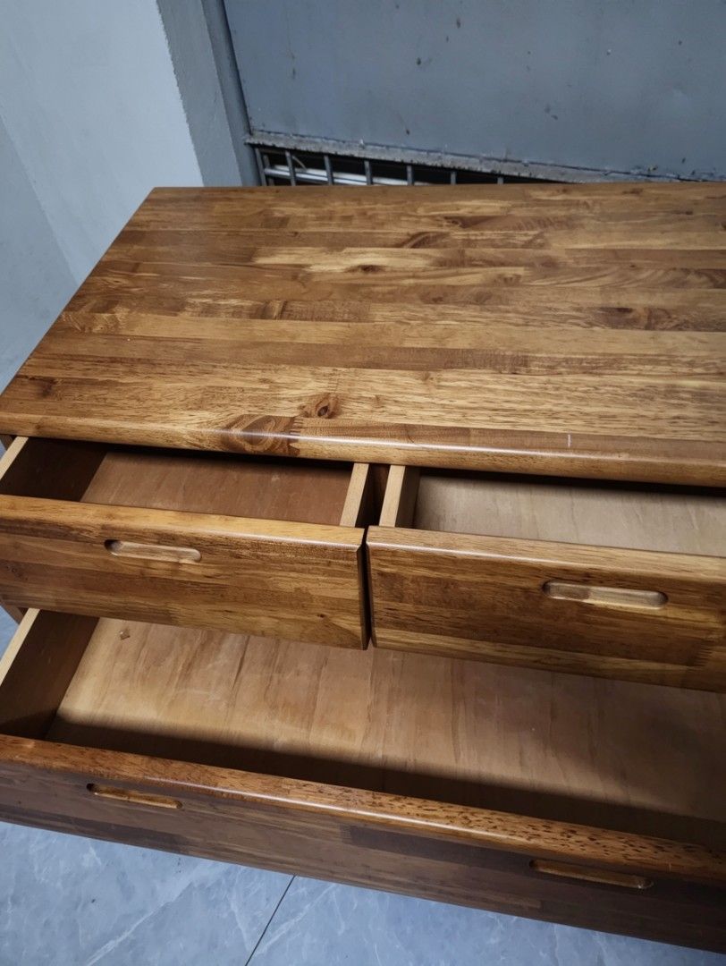 Solid wood Tv rack (Category: Shelves, Cabinets & Racks) located in Quezon City. Submitted by amber___18 (Listing ID 1440389782, Image 2). Description: -tv rack with drawers -japan surplus matibay - Solid wood construction for durability - Four spacious drawers for ample storage - Smooth-gliding drawers for easy access - Attractive finish complements any decor - Minor signs of wear, adding character.
