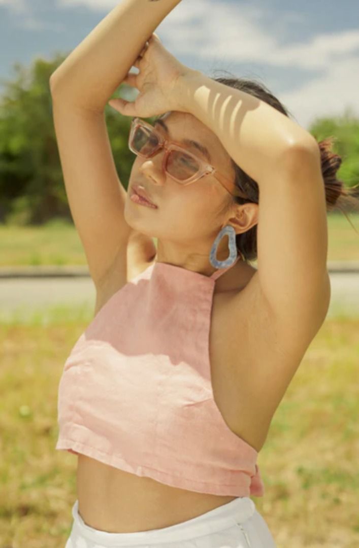 Sunki Fan Yourself Reversible Halter Top (Pink & White) (Category: Sleeveless) located in Santa Rosa. Submitted by erimv (Listing ID 1440447704, Image 2). Description: DETAILS & FIT Halter top with tie neckline and a 3-inch back tie detail. Cropped length. Adjustable straps. Wear it three ways — cross-back, parallel straps, or around the neck — but you’re free to get more creative. Fits true to size, but size up if you’d like more coverage on the