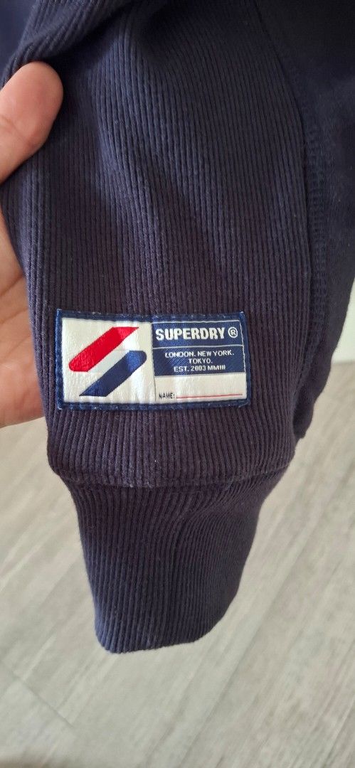 Superdry Navy Blue Sweatshirt Size L (Category: Coats, Jackets and Outerwear) located in Paranaque City. Submitted by mississy1979 (Listing ID 1440432752, Image 3). Description: Superdry Code Crew Neck Sweatshirt – Navy, Size L 🔵 Authentic Superdry sweatshirt in navy blue. Large embroidered logo on chest, logo patch on sleeve cuff. Size L. Good pre-loved condition. ✅ ₱500 / open to reasonable offers 📦 Ships via J&T, GogoExpress, LBC, Grab, or L