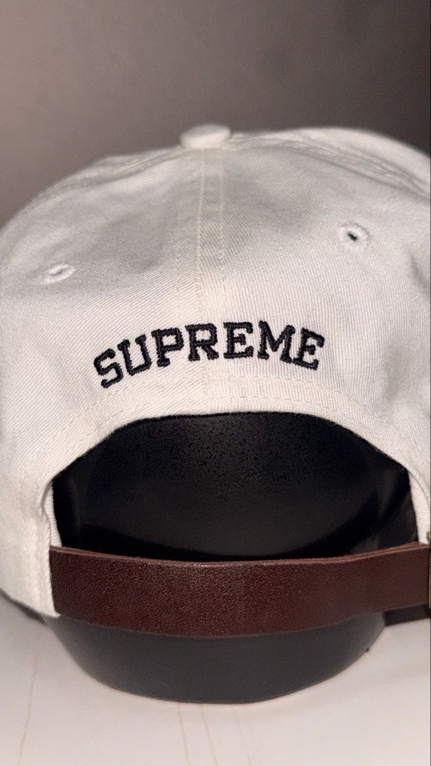 Supreme Rubber Logo 6-Panel Cap (Category: Caps & Hats) located in Taguig. Submitted by aa_decluttering (Listing ID 1440478209, Image 3). Description: Condition: Brand New Unused Logo: Iconic red rubberized logo on the front. Back Detail: Embroidered Supreme branding at the rear. Closure: Genuine leather adjustable strap (One size fits all). Material: Durable cotton canvas. Pickup: Kapitolyo Pasig Shipping fee c/o buyer.