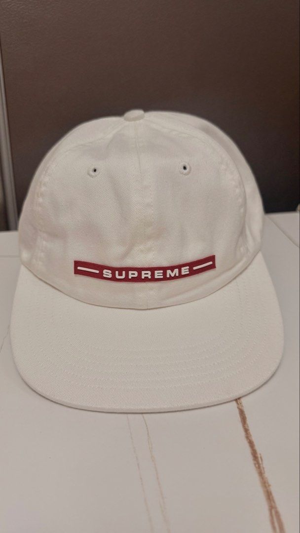 Supreme Rubber Logo 6-Panel Cap (Category: Caps & Hats) located in Taguig. Submitted by aa_decluttering (Listing ID 1440478209, Image 1). Description: Condition: Brand New Unused Logo: Iconic red rubberized logo on the front. Back Detail: Embroidered Supreme branding at the rear. Closure: Genuine leather adjustable strap (One size fits all). Material: Durable cotton canvas. Pickup: Kapitolyo Pasig Shipping fee c/o buyer.