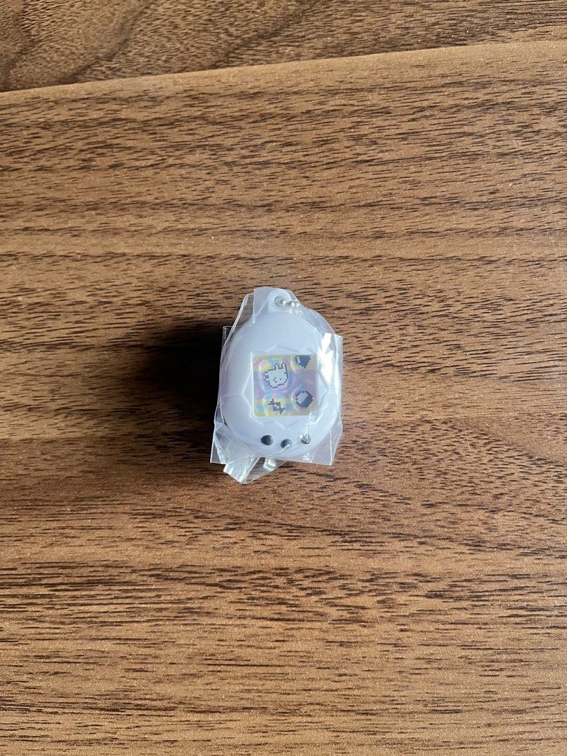 Tamagotchi Shaker Gacha Charm (White) (Category: Character Goods) located in Makati City. Submitted by hvbris (Listing ID 1440471484, Image 1). Description: WTT for light pink version..