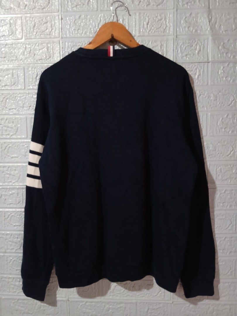 Thom Browne Navy Sweatshirt with White Stripe (Category: Luxury Apparel) located in Davao. Submitted by marissasof29286 (Listing ID 1440452220, Image 3). Description: -Classic Navy Sweatshirt from Thom Browne -Features Signature White Stripes on the sleeve -Small woven label detail -Made in Italy -Perfect for a stylish casual look -Size 4 Large to XL fit -Dimes 22x27 -Color rate 9.5/10 No issue.