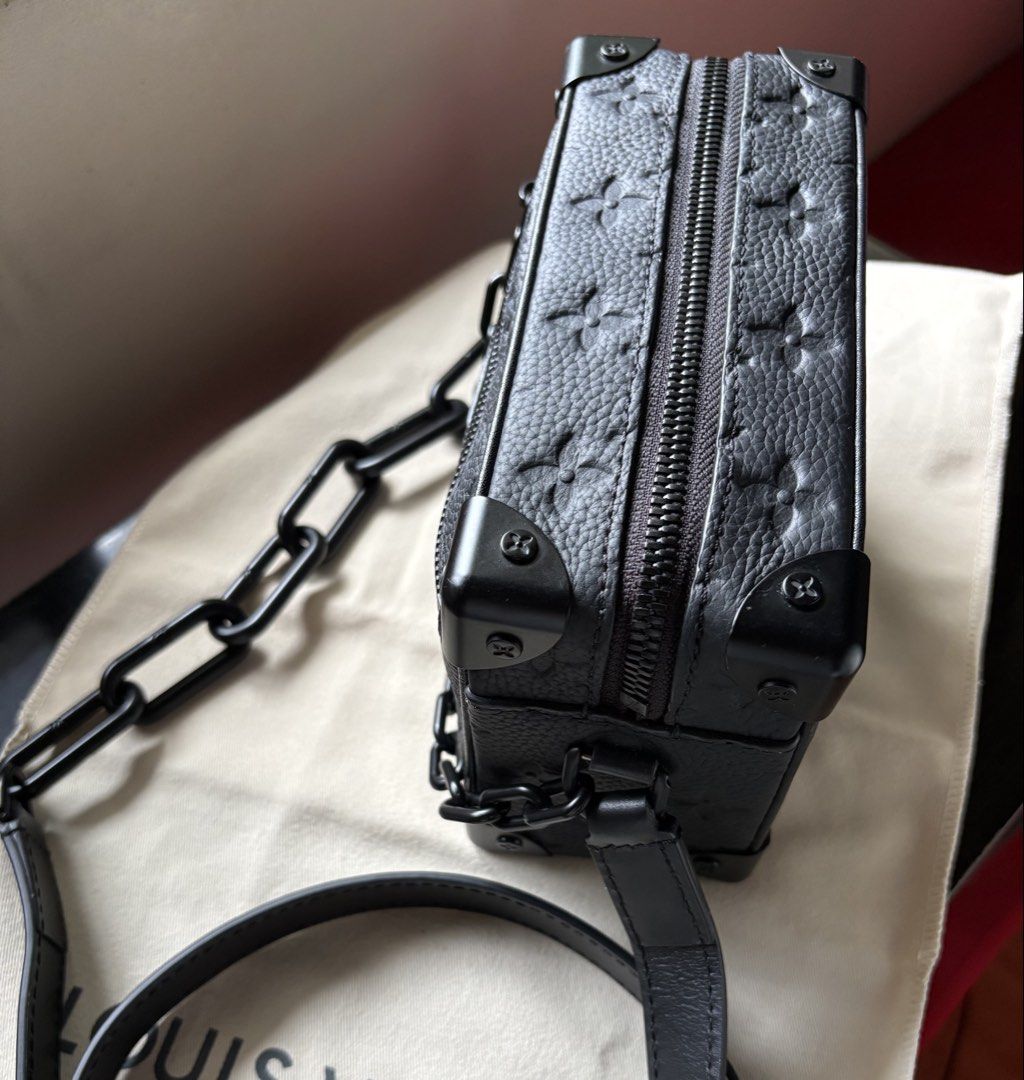 Trunk Bag (Category: Luxury Bags & Wallets) located in Mandaue City. Submitted by jane2872 (Listing ID 1440571337, Image 1). Description: - mini soft trunk bag in black - Signature monogram pattern on textured leather - Versatile carrying options: chunky chain strap and leather shoulder strap - Secure zipper closure .