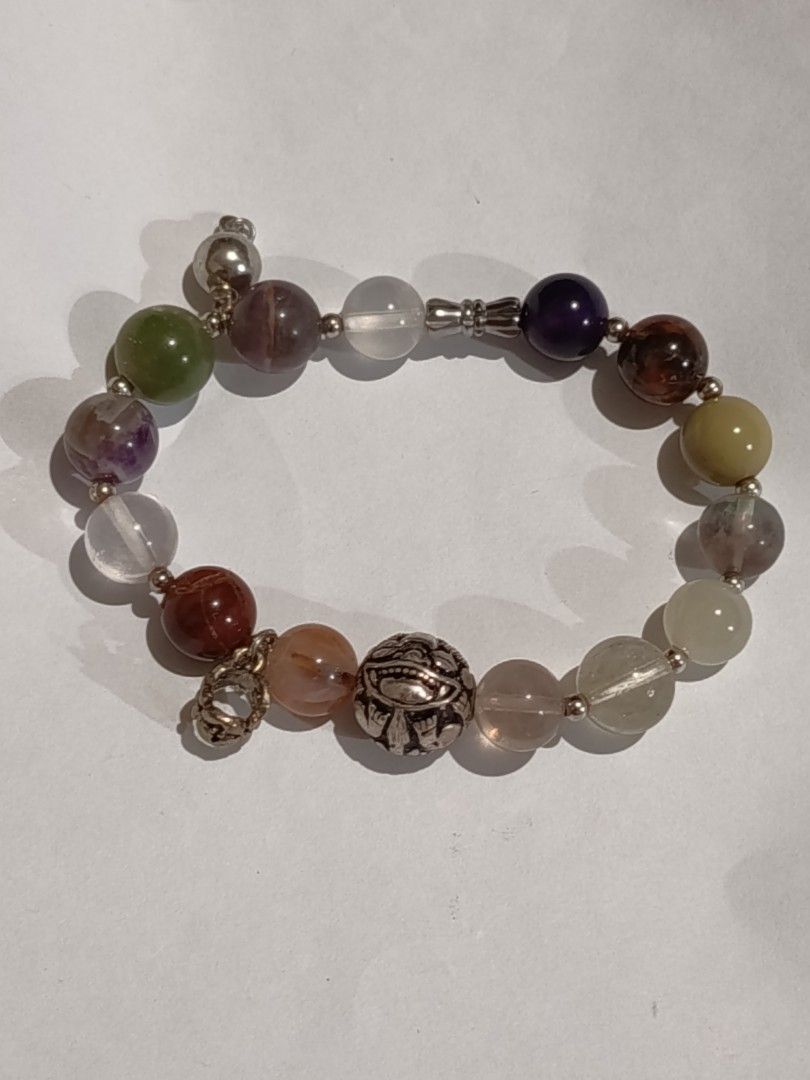 Unique Quartz Bracelet with Charms/Accents (Category: Bracelets) located in Famy. Submitted by potato.label (Listing ID 1440395520, Image 3). Description: - Unique bracelet with a mix quartz stone beads - Features different charms with intricate designs - Elastic band for comfortable and easy wear. - Perfect accessory to elevate your style..