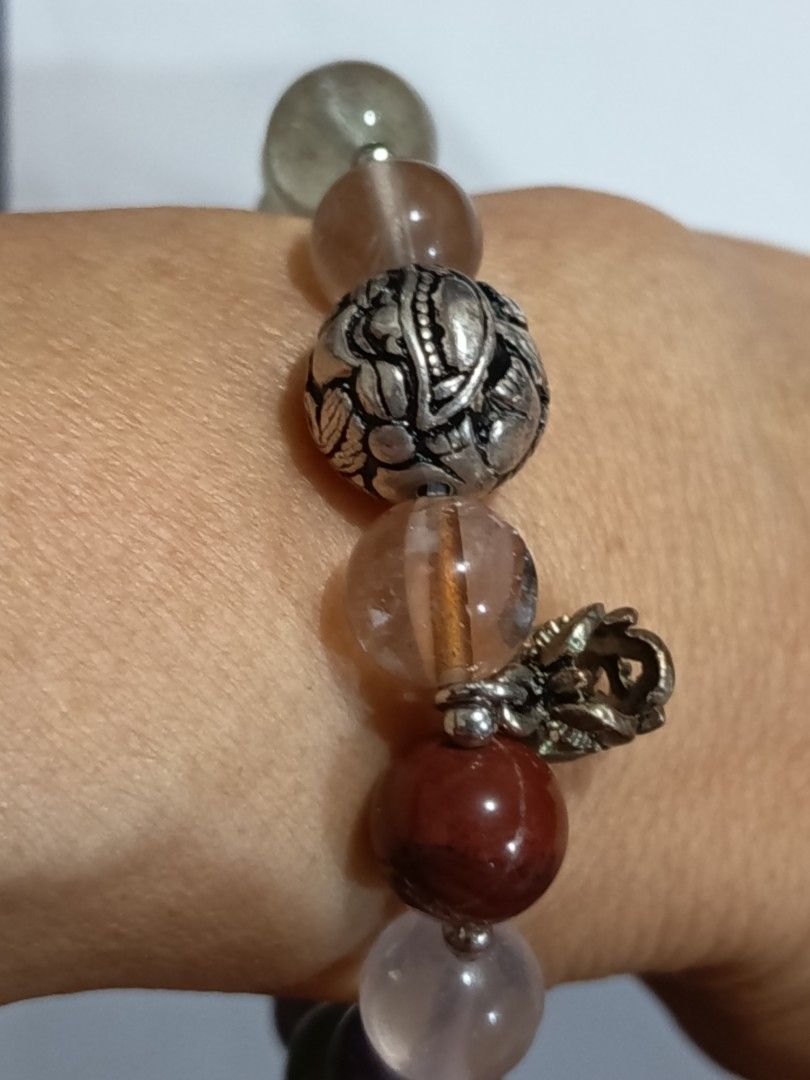 Unique Quartz Bracelet with Charms/Accents (Category: Bracelets) located in Famy. Submitted by potato.label (Listing ID 1440395520, Image 1). Description: - Unique bracelet with a mix quartz stone beads - Features different charms with intricate designs - Elastic band for comfortable and easy wear. - Perfect accessory to elevate your style..
