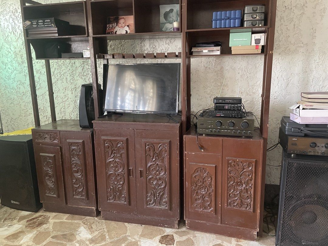 Vintage Audio Amplifier and Speakers (Category: Shelves, Cabinets & Racks) located in Las Pinas. Submitted by espalayan (Listing ID 1440410732, Image 1). Description: - Complete vintage audio set - Includes one large speaker and one smaller speaker - Comes with a wooden cabinet - Cabinet features a built-in TV - Multiple audio components stacked on top of the cabinet - Cabinet has ornate carved doors - Ideal for creating a retro aesthetic.