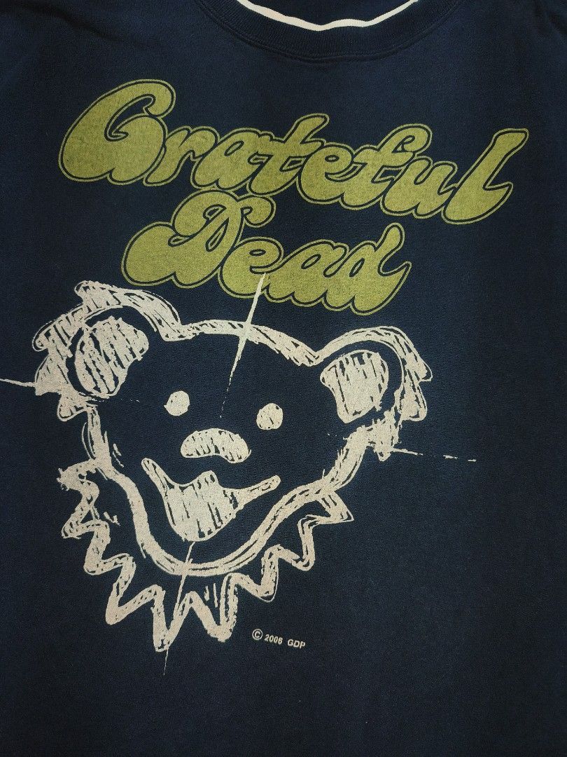 Vintage Grateful Dead Dancing Bear T-Shirt 2006 (Category: Tshirts & Polo Shirts ) located in Cagayan de Oro. Submitted by adamfitz (Listing ID 1440410089, Image 2). Description: - Navy blue Grateful Dead t-shirt - Features iconic dancing bear graphic on front - Grateful Dead lightning bolt logo on sleeve - Made in 2006 - Great for any Grateful Dead fan size large has a hole in the back payment: Gcash courier: J&T color may vary due to lightning 