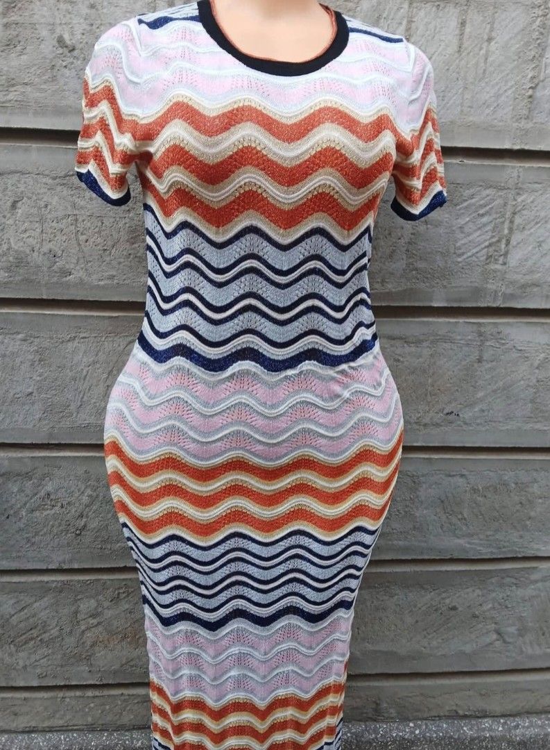 Wavy Zigzag Knit Midi Dress (Category: Dresses) located in Cavite. Submitted by MLstore (Listing ID 1440517306, Image 1). Description: - Eye-catching colorful wavy zigzag pattern - Midi dress length - Short sleeves and crew neck Medium to Large size - Stretchy, form-fitting knit fabric - Ideal for casual wear or beach vacations - Unique and stylish design.