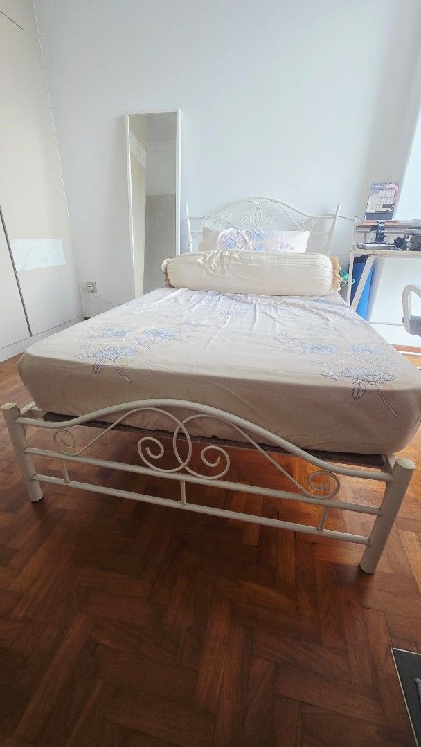 White Metal Bed Frame (Category: Bed Frames & Mattresses) located in Singapore. Submitted by zeecollezione (Listing ID 1440407132, Image 2). Description: - White metal bed frame - Features ornate scrollwork on headboard and footboard - Fits Super Single mattress size - Easy assembly process - Ready for its new home!.