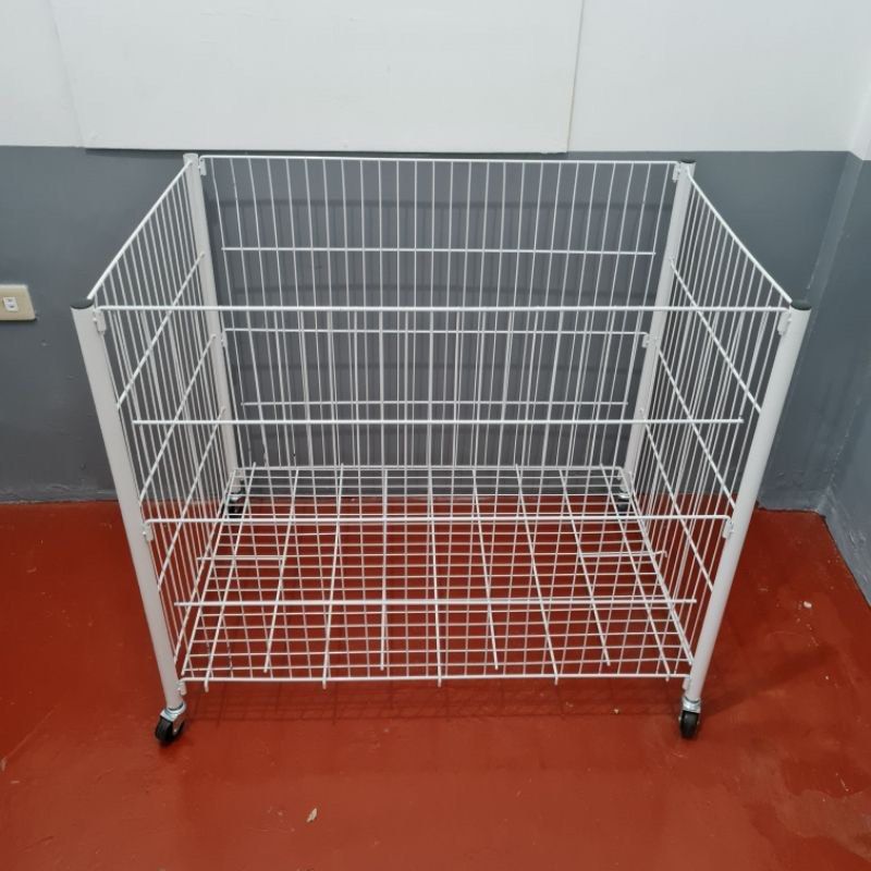 White Metal Matting Display Basket with Wheels (Category: Storage Boxes & Baskets) located in Quezon City. Submitted by dagoodfindsph (Listing ID 1440457584, Image 2). Description: Powder Coated Basket Rack Height: 80cm Width: 60 cm Length: 90cm Thickness: 5mm - White wire basket on wheels - Ideal for retail displays or storage - Good size for various items - Easy to move with wheels - Sturdy construction - Ready for a new home .