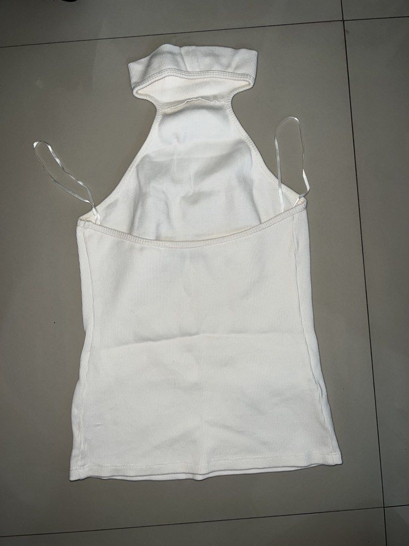 White MNG Ribbed Halter Neck Top Size S (Category: Sleeveless) located in Manila. Submitted by ladx_ (Listing ID 1440459418, Image 3). Description: - MNG White Ribbed Halter Neck Top - Size: S (EUR S, MEX CH) - High neckline with stylish cut-out detail - Sleeveless design - Made in Bangladesh - Versatile: Great for layering or wearing on its own - Used once only .