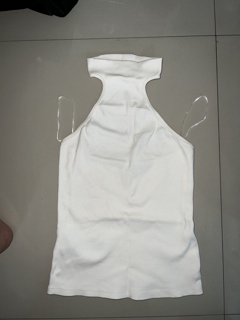 White MNG Ribbed Halter Neck Top Size S (Category: Sleeveless) located in Manila. Submitted by ladx_ (Listing ID 1440459418, Image 2). Description: - MNG White Ribbed Halter Neck Top - Size: S (EUR S, MEX CH) - High neckline with stylish cut-out detail - Sleeveless design - Made in Bangladesh - Versatile: Great for layering or wearing on its own - Used once only .