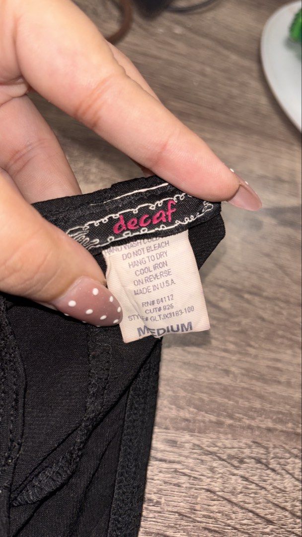 Y2K Decaf glitter Halter Top (Category: Sleeveless) located in Ozamiz City. Submitted by franchingkang (Listing ID 1440469226, Image 3). Description: - Black halter top - Features sparkly wavy lines all over - Ties at the neck for adjustable fit - Stretchy can fit up to Large .