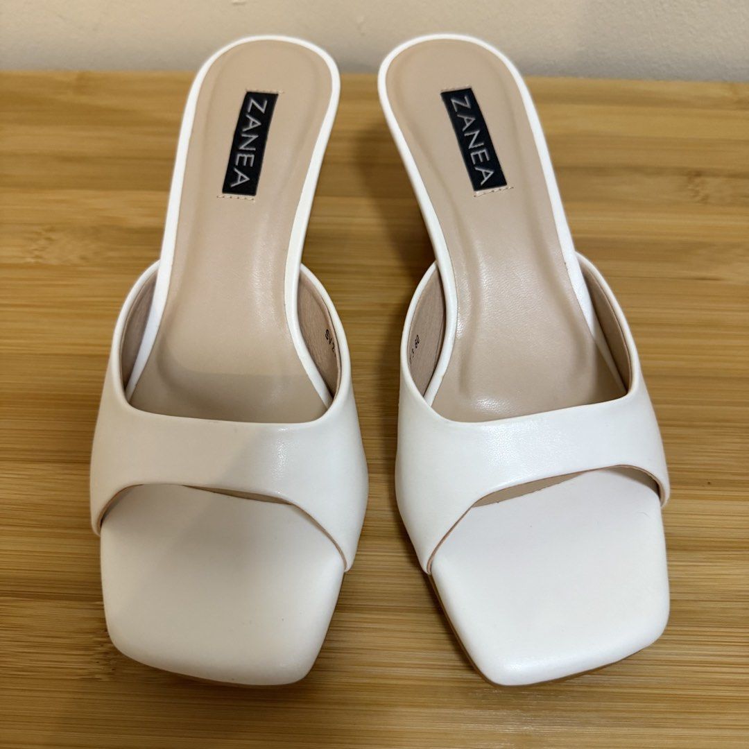 Zanea White Square Toe Heeled Mules (Category: Heels) located in Bulacan. Submitted by declutter_diary02 (Listing ID 1440429924, Image 2). Description: - USED ONCE (for photos only) - Brand: Zanea - Color: White - Style: Heeled Mules - Toe Shape: Square - Closure: Slip-on - Size: 60 - Includes: Original box - Versatile: Perfect for dressing up or down .