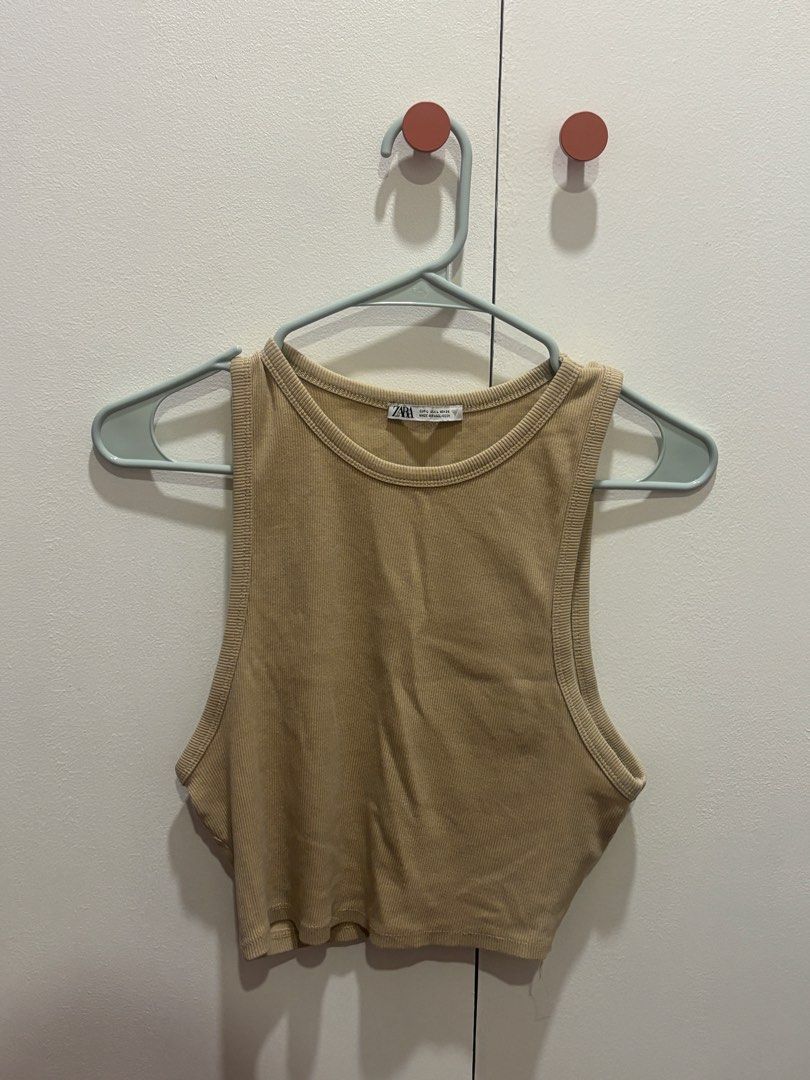 ZARA Ribbed Tank Top - Beige - Size L (Category: Sleeveless) located in Muntinlupa City. Submitted by beacq (Listing ID 1440472022, Image 1). Description: - ZARA Basic Beige Ribbed Tank Top - Sleeveless with Racerback Design - Comfortable and Versatile - Easy to Pair with Jeans or Shorts - Size: L.