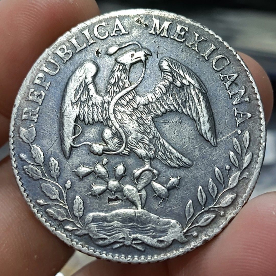 1886 Mexican Silver Peso Coin (Category: Currency) located in Quezon City. Submitted by Coiners (Listing ID 1440595055, Image 2). Description: - Authentic 1886 Mexican Silver Peso coin - Features the Mexican coat of arms - Displays the radiant Liberty cap - Ideal for coin collectors.