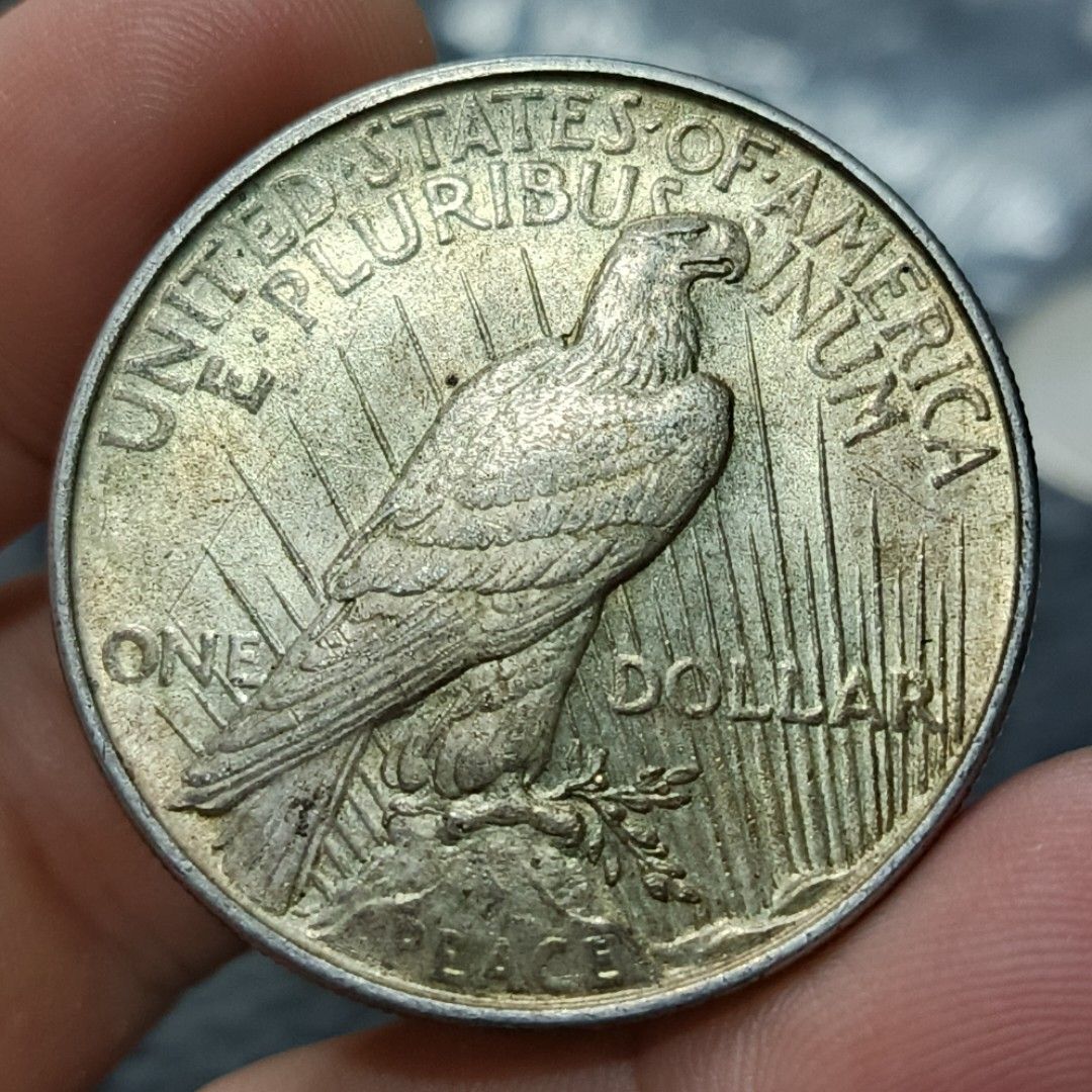 1922 Peace Silver Dollar Coin (Category: Currency) located in Quezon City. Submitted by Coiners (Listing ID 1440595164, Image 2). Description: - Authentic 1922 Peace Dollar coin - Features iconic Lady Liberty on the obverse - Showcases a majestic eagle on the reverse - Highly collectible item, a must-have for any coin enthusiast - Excellent addition to any coin collection display - Please refer to the provided photos for detailed condition and ap