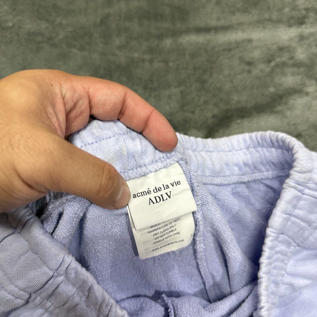 ADLV SWEAT PANTS (Category: Luxury Apparel) located in Santa Maria. Submitted by rarefindslt (Listing ID 1440687972, Image 2). Description: ADLV SWEAT PANTS (SWIPE LEFT FOR MORE DETAILS..) size 2 on tag (fits to L dimes) in solid good condition rate! complete tags for authenticity, embroidered side script and logo, adjustable string, side pockets, solid purple color rate! can pass as new! no issue.