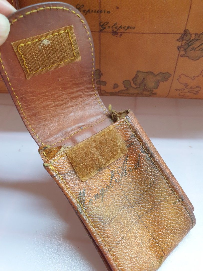 Alviero Martini Map Print Leather Pouch with Keychain (Category: Purses & Pouches) located in Las Pinas. Submitted by anggesmart (Listing ID 1440702934, Image 3). Description: Preloved Alviero Martini Leather Pouch Features classic geo design Can be used as tool pouch or cigarette pouch With signs of usage, needs cleaning Accepts bpi or gcash.