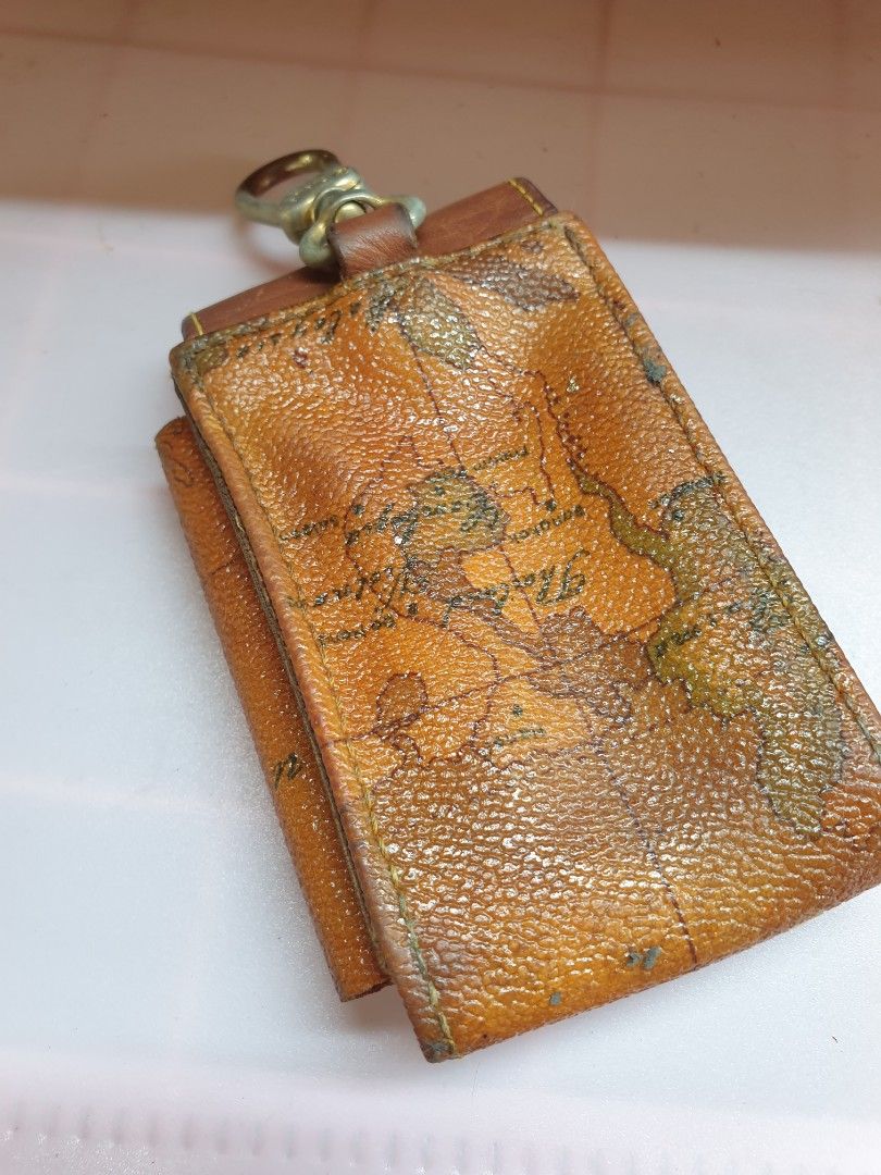 Alviero Martini Map Print Leather Pouch with Keychain (Category: Purses & Pouches) located in Las Pinas. Submitted by anggesmart (Listing ID 1440702934, Image 2). Description: Preloved Alviero Martini Leather Pouch Features classic geo design Can be used as tool pouch or cigarette pouch With signs of usage, needs cleaning Accepts bpi or gcash.
