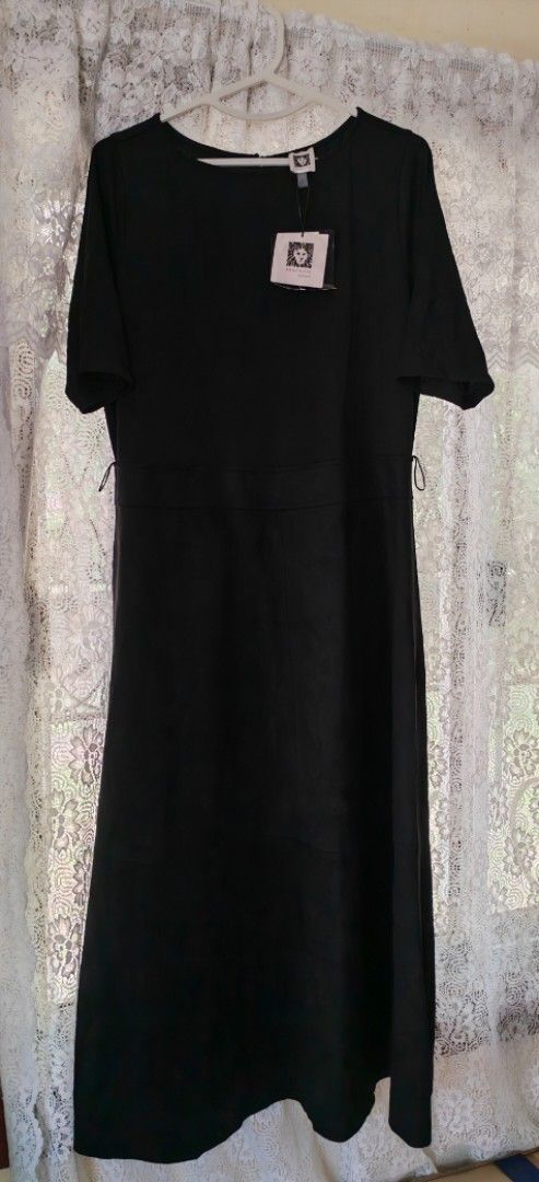 Anne Klein Black Dress (Category: Dresses) located in Cavite. Submitted by MLstore (Listing ID 1440613019, Image 1). Description: - Brand: Anne Klein -US Bought - Style: Dress - Color: Black - Features: Short sleeves, round neckline Size : 10 fits to Large size -Comfy fabric - Detail: Adjustable waist tie for a cinched silhouette - Versatility: Easily dressed up or down for various occasions - Comfort: Designed for a comfortable and flattering fi
