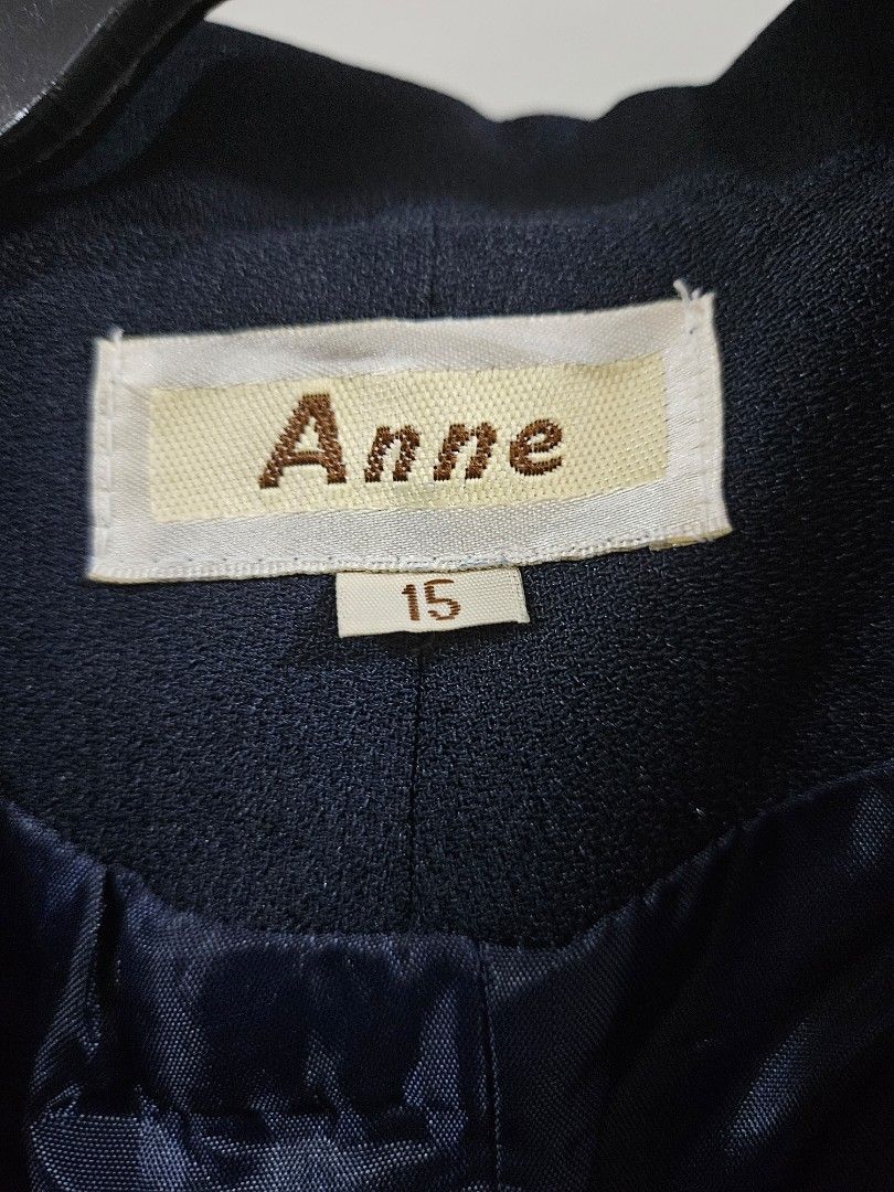 Anne Navy Blue Double-Breasted Blazer Size 15 (Category: Coats, Jackets and Outerwear) located in Caloocan City. Submitted by rm.diaz (Listing ID 1440688986, Image 2). Description: - Navy blue blazer - Brand: Anne - Size: 15 - Closure: Two-button front - Pockets: Two flap pockets on the front - Lining: Shiny navy material - Style: Suitable for both formal and casual occasions.