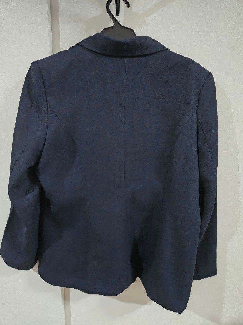 Anne Navy Blue Double-Breasted Blazer Size 15 (Category: Coats, Jackets and Outerwear) located in Caloocan City. Submitted by rm.diaz (Listing ID 1440688986, Image 3). Description: - Navy blue blazer - Brand: Anne - Size: 15 - Closure: Two-button front - Pockets: Two flap pockets on the front - Lining: Shiny navy material - Style: Suitable for both formal and casual occasions.
