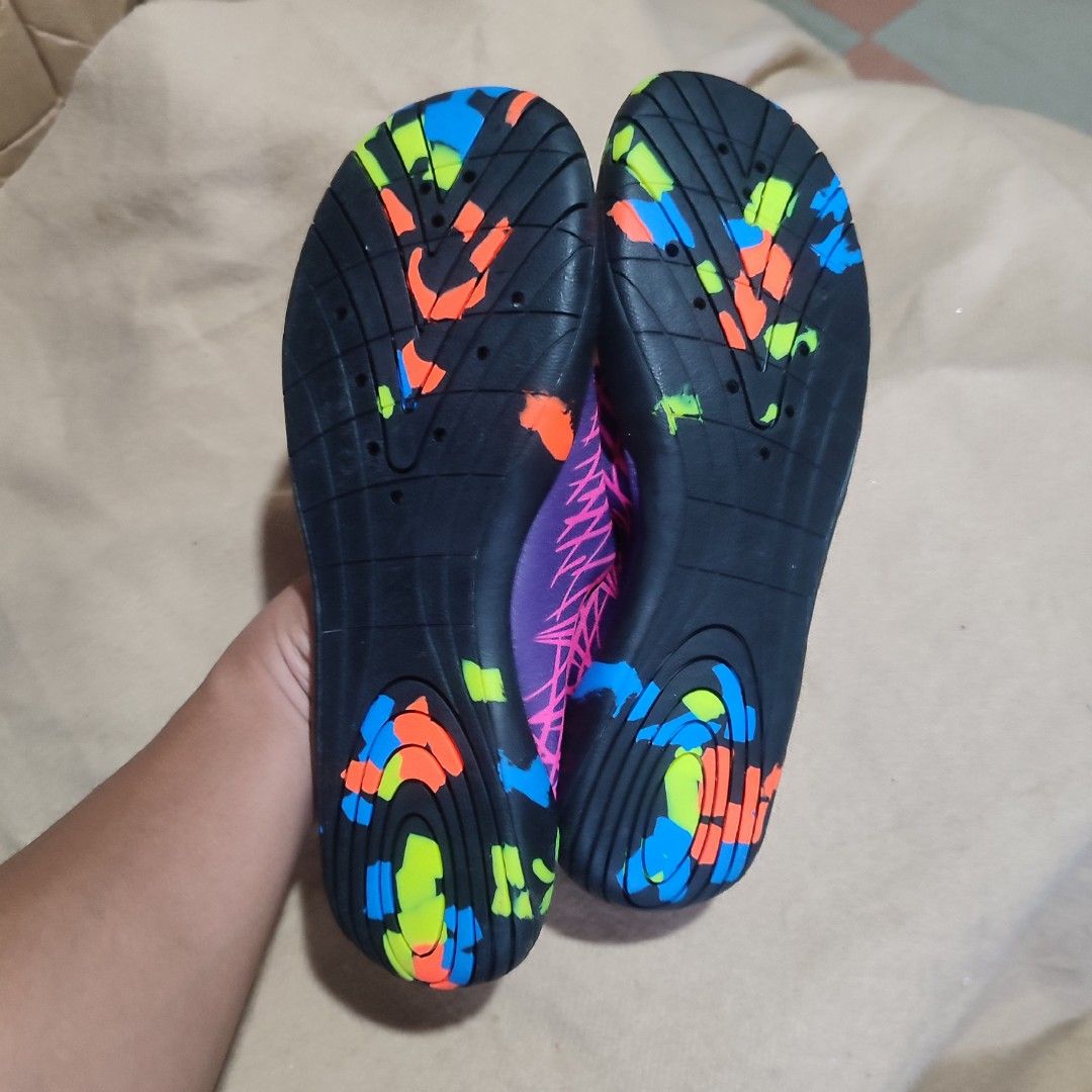 Aqua Shoes Size EUR 38 (Category: Slippers and slides) located in Baguio. Submitted by shmily01 (Listing ID 1440653207, Image 2). Description: - Aqua shoes in vibrant purple and pink. - Features a bright, colorful sole. - Ideal for water activities and beach trips. - Size: EUR 38. - Condition: Looks new. #aquashoes #watershoes.