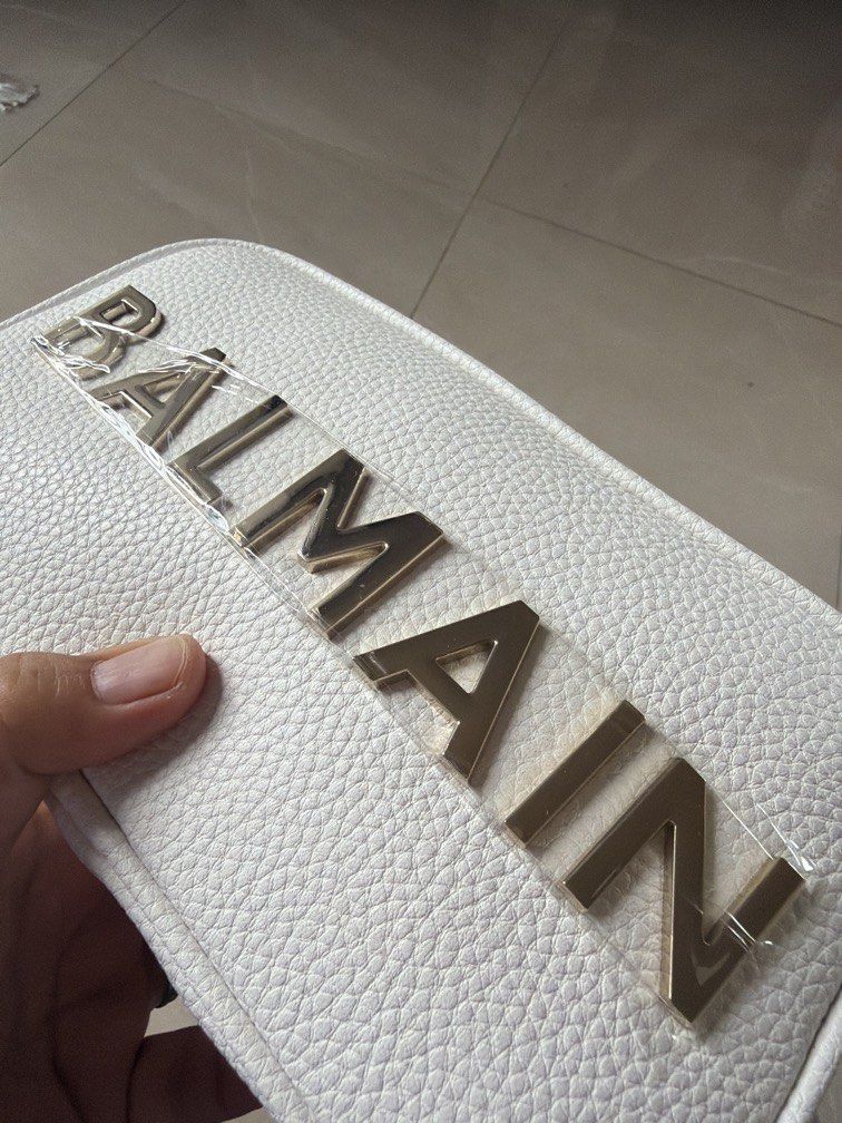 Authentic BNEW BALMAN crossbody in pebbled leather (Category: Luxury Bags & Wallets) located in Cagayan de Oro. Submitted by kenzeepie (Listing ID 1440601846, Image 2). Description: Bnew! Still With plastic film and tag! Bought jn Balmain Dubai With dust-bag and ecobag.