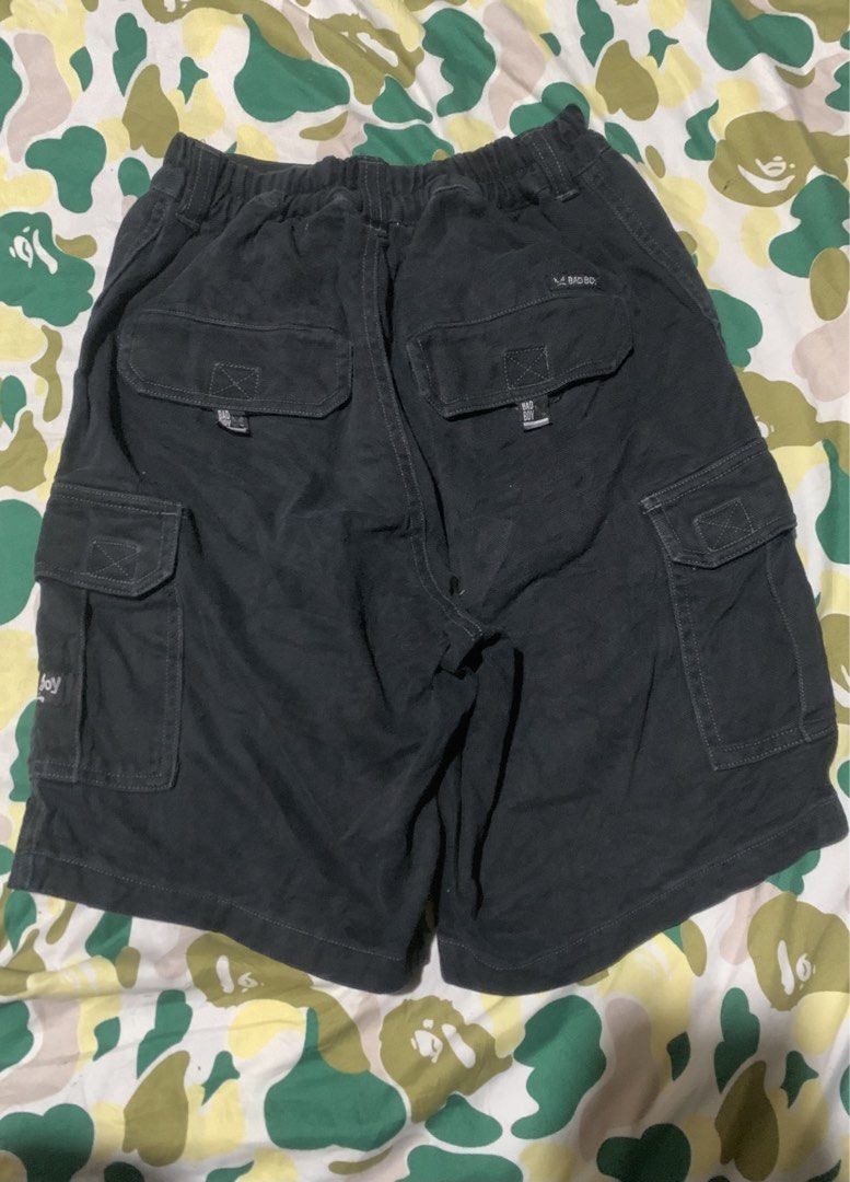 Bad Boy Cargo Shorts Black Men's Size 30 (Category: Shorts) located in Cagayan de Oro. Submitted by agboysalis60090 (Listing ID 1440711909, Image 2). Description: Black cargo shorts from Bad Boy. Multiple pockets for storage. Elastic waistband with drawstring. Button and zip fly. Great for casual wear or outdoor activities. Check measurements for best fit..