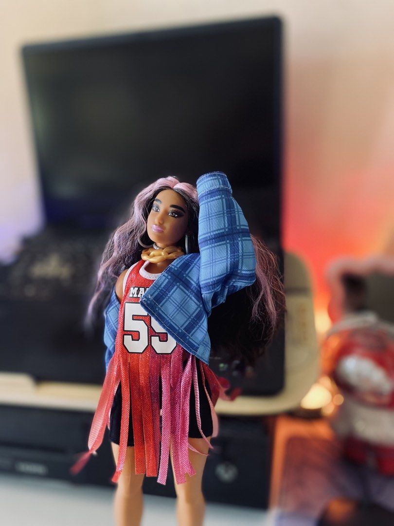 Barbie Extra #13 (Category: Kids Toys) located in Quezon City. Submitted by micah0920 (Listing ID 1440722972, Image 2). Description: - Barbie doll in sporty Malibu 59 outfit - Long, wavy purple-streaked hair - Gold chain necklace - Fringed top - Blue plaid jacket - Yellow heels - Ideal for collectors and play.