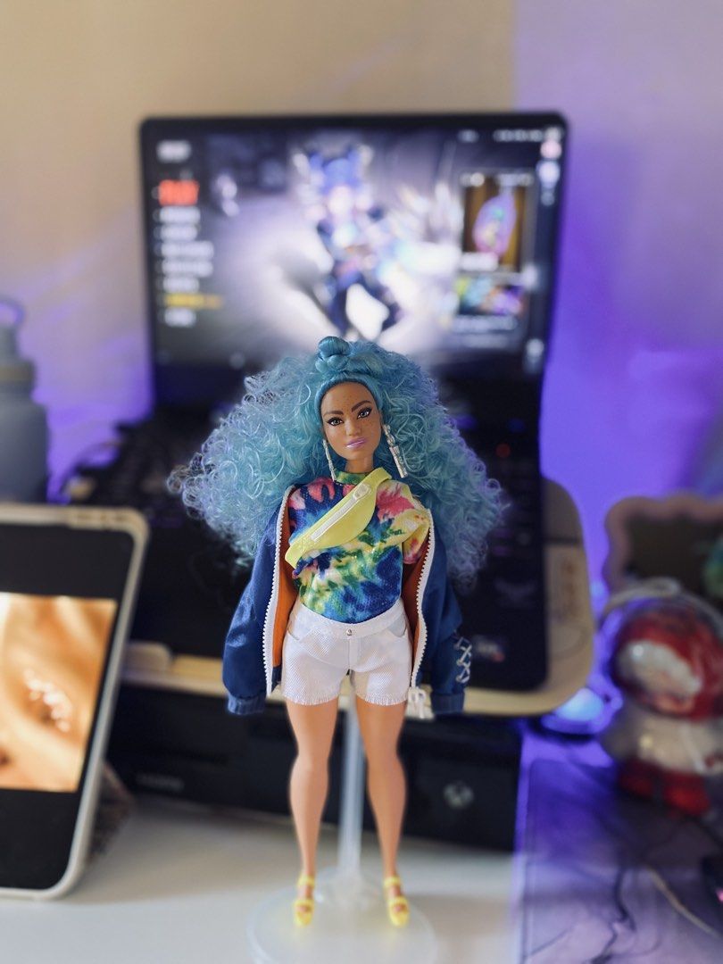 Barbie Extra #4 (Category: Kids Toys) located in Quezon City. Submitted by micah0920 (Listing ID 1440722567, Image 1). Description: - Vibrant blue curly hair - Trendy tie-dye top - White shorts - Stylish blue jacket - Fun yellow fanny pack - Chic heels - Ideal for collectors and playtime - Ready for a new home!.