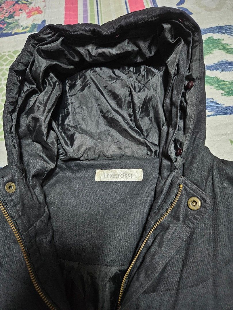 Black Hooded Puffer Trench Coat (Category: Coats, Jackets and Outerwear) located in Caloocan City. Submitted by rm.diaz (Listing ID 1440614776, Image 2). Description: - Black puffer Trench Coat - Attached hood - Zip-up front with button closure - Two front pockets - Lined interior - Ideal for cold weather and layering.