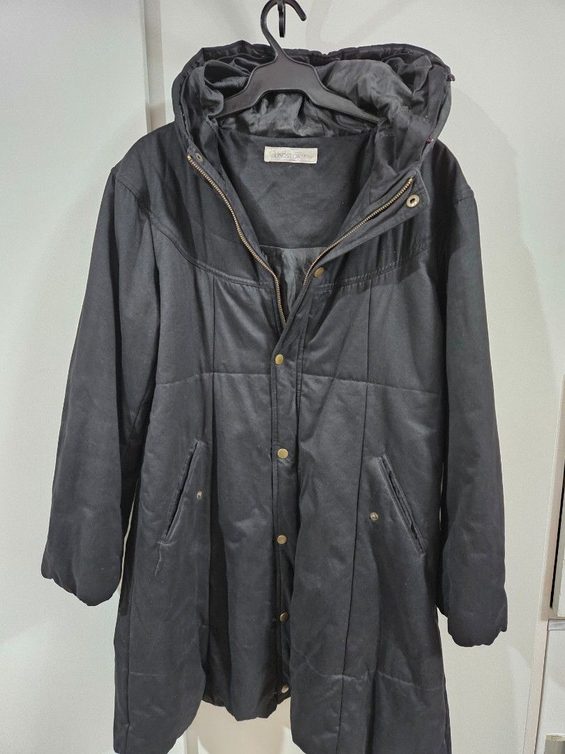 Black Hooded Puffer Trench Coat (Category: Coats, Jackets and Outerwear) located in Caloocan City. Submitted by rm.diaz (Listing ID 1440614776, Image 1). Description: - Black puffer Trench Coat - Attached hood - Zip-up front with button closure - Two front pockets - Lined interior - Ideal for cold weather and layering.